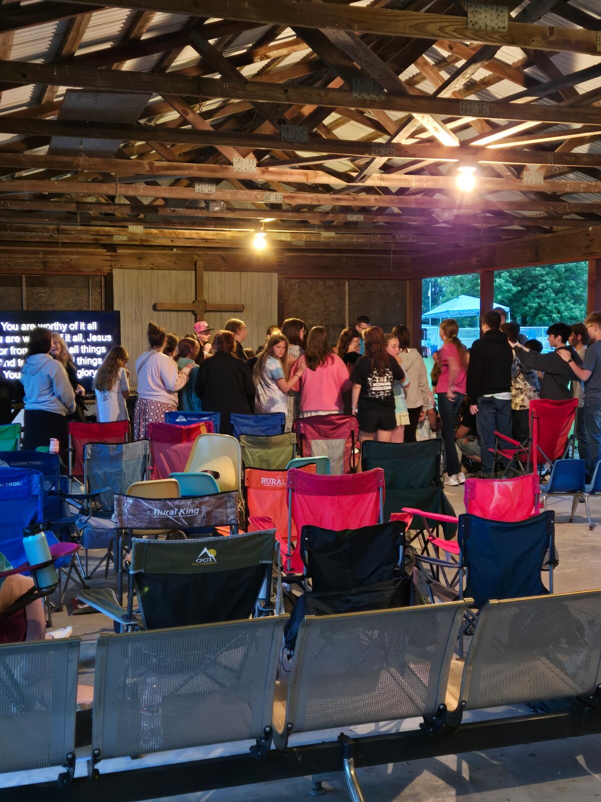 Campers gathered at the front for prayer during evening worship